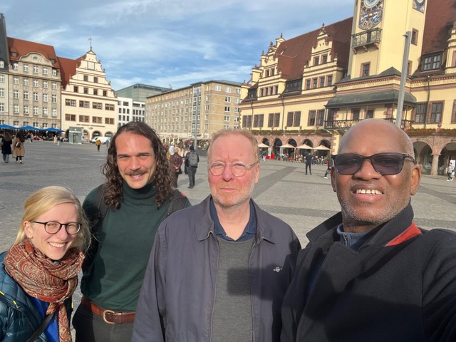 The picture shows ANCIP members from Leipzig (S.E. Warnck, V.J. Schober, U. Engel) and El-Ghassim Wane, on the market square in Leipzig, smiling into the camera.