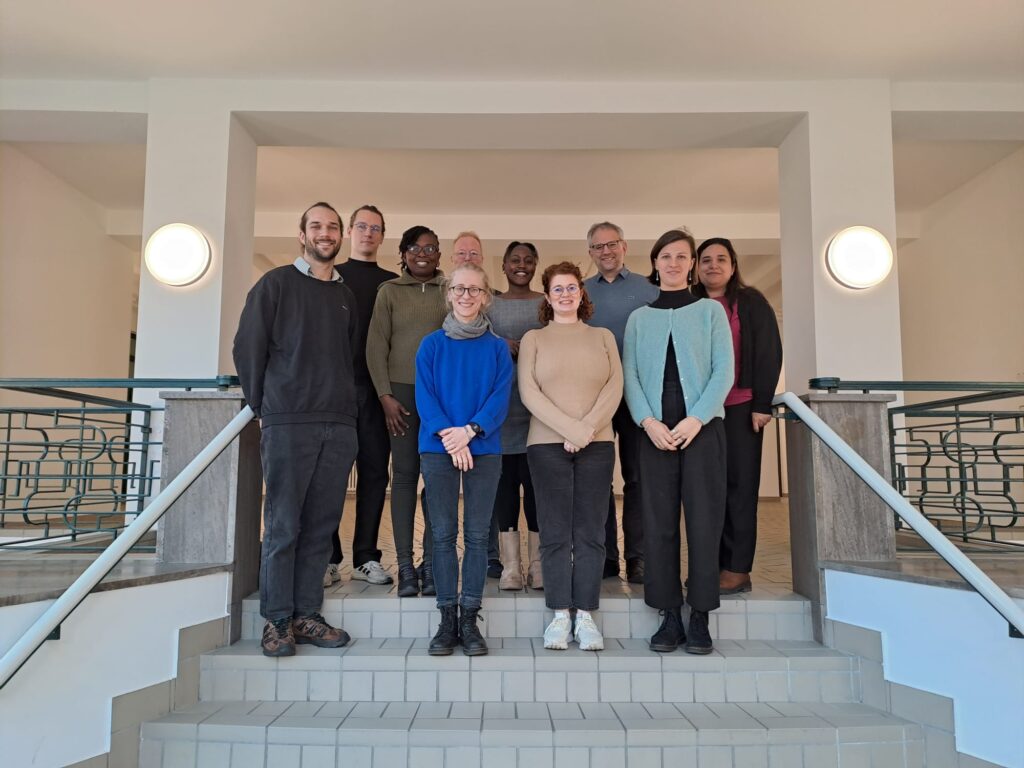 The picture shows the ANCIP team standing on stairs as a group at INEF in Duisburg.